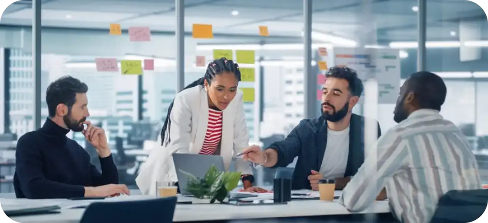About Us: a man and woman looking at a laptop
